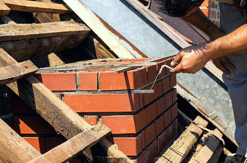 New courses rising on a Staten Island chimney under repair