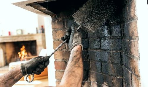 Fine brushing a firebox before hearth mending